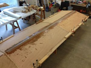 The bottom panels are turned over and the outside of the keel has been taped.